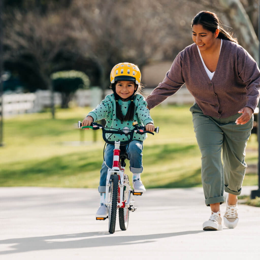 Child riding woom bike