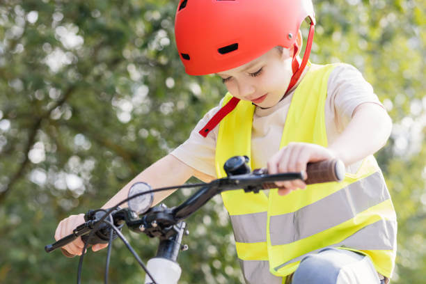 Child reiding bike in hi vis jacket